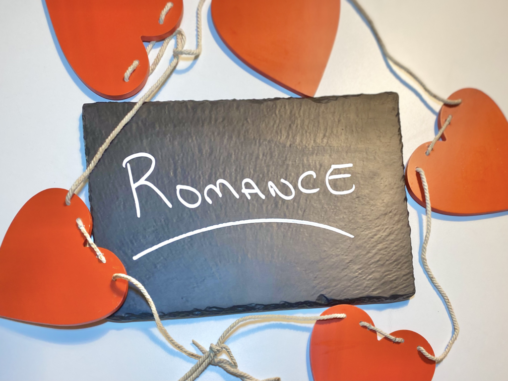 Chalk Slate with the Word Romance on it