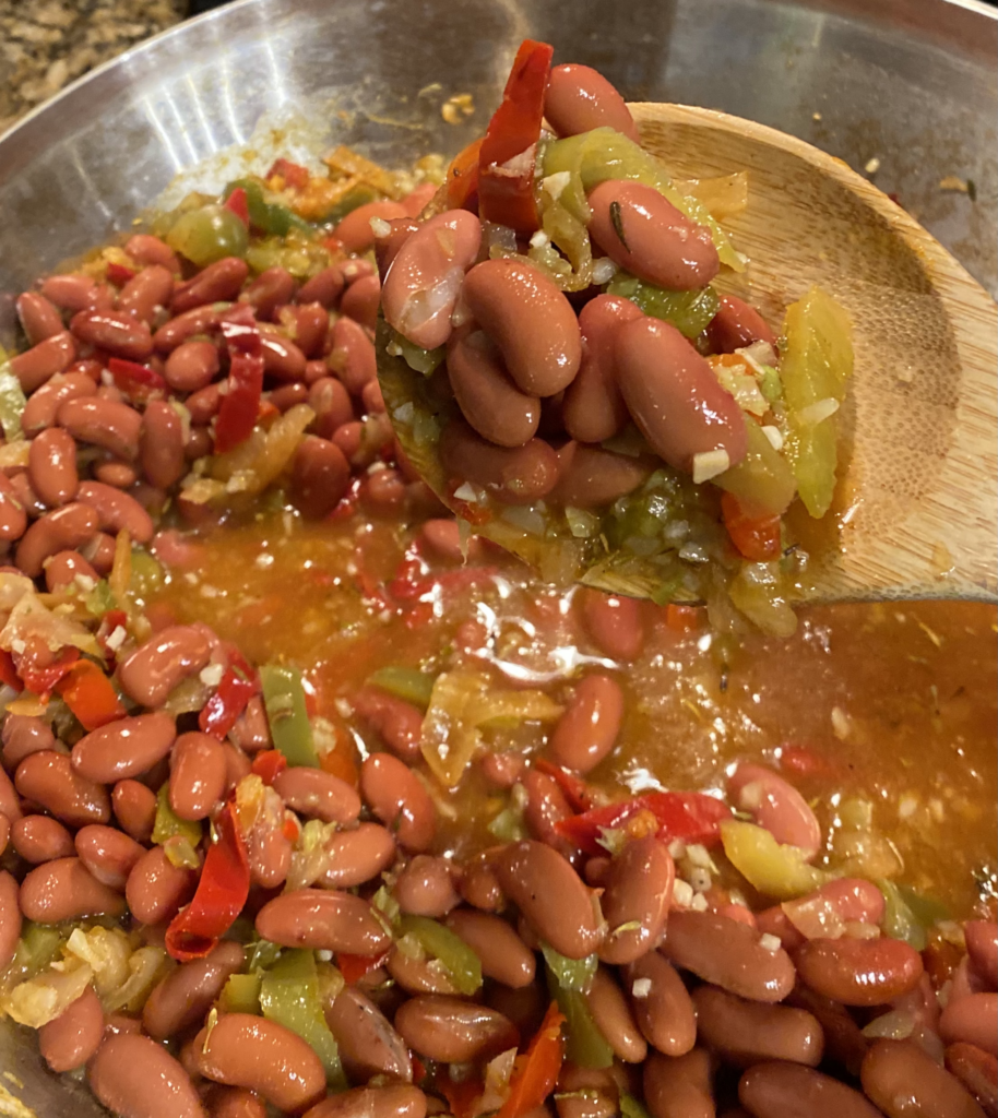 Red Beans with Peppers, Onions and other seasonings in Skillet on Stove