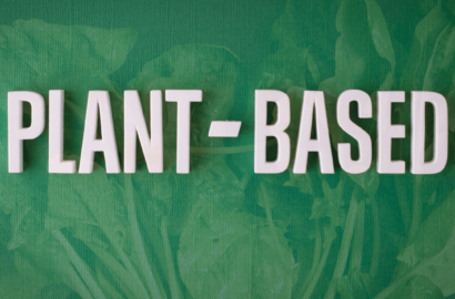 The words plant based in white on a green background