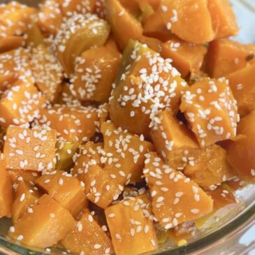 Bowl of Golden Beet and Sweet Potato Salad topped with Sesame Seeds