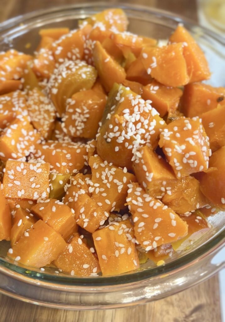 Bowl of Golden Beet and Sweet Potato Salad topped with Sesame Seeds