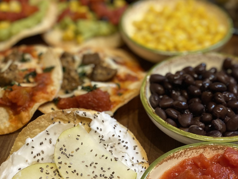 Corn Tostadas and corn, beans, diced tomatoes, pear, vegan cream cheese and chia seeds