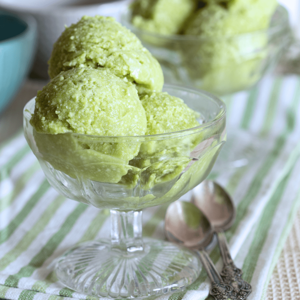 Three scoops of avocado ice cream in a bowl