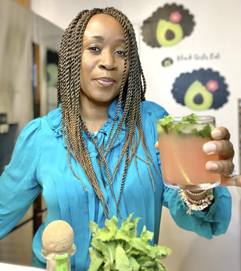 woman holding a paloma mocktail