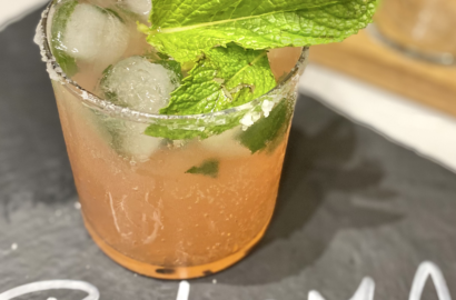 Paloma Drink with Mint and Lime Garnish