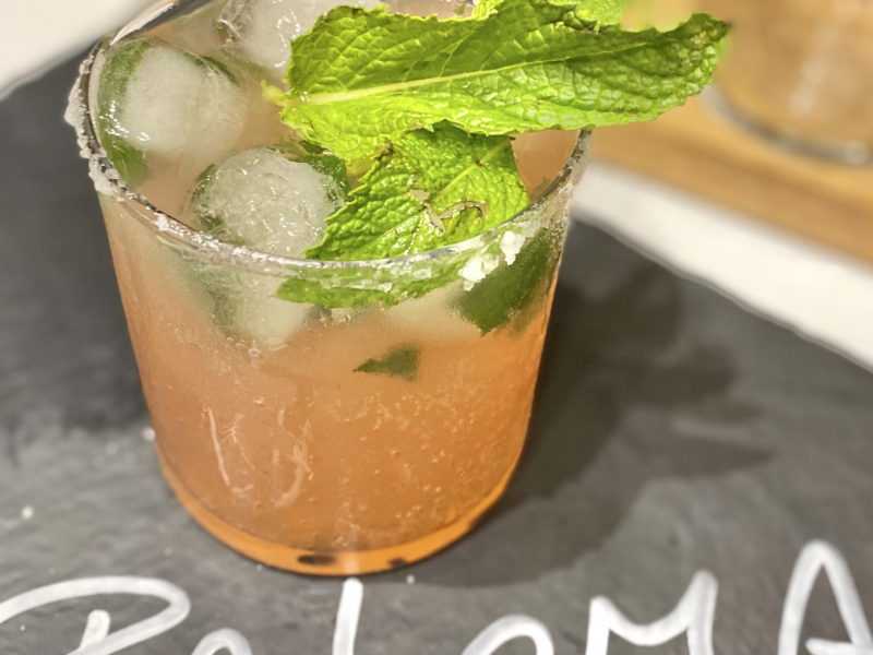 Paloma Drink with Mint and Lime Garnish