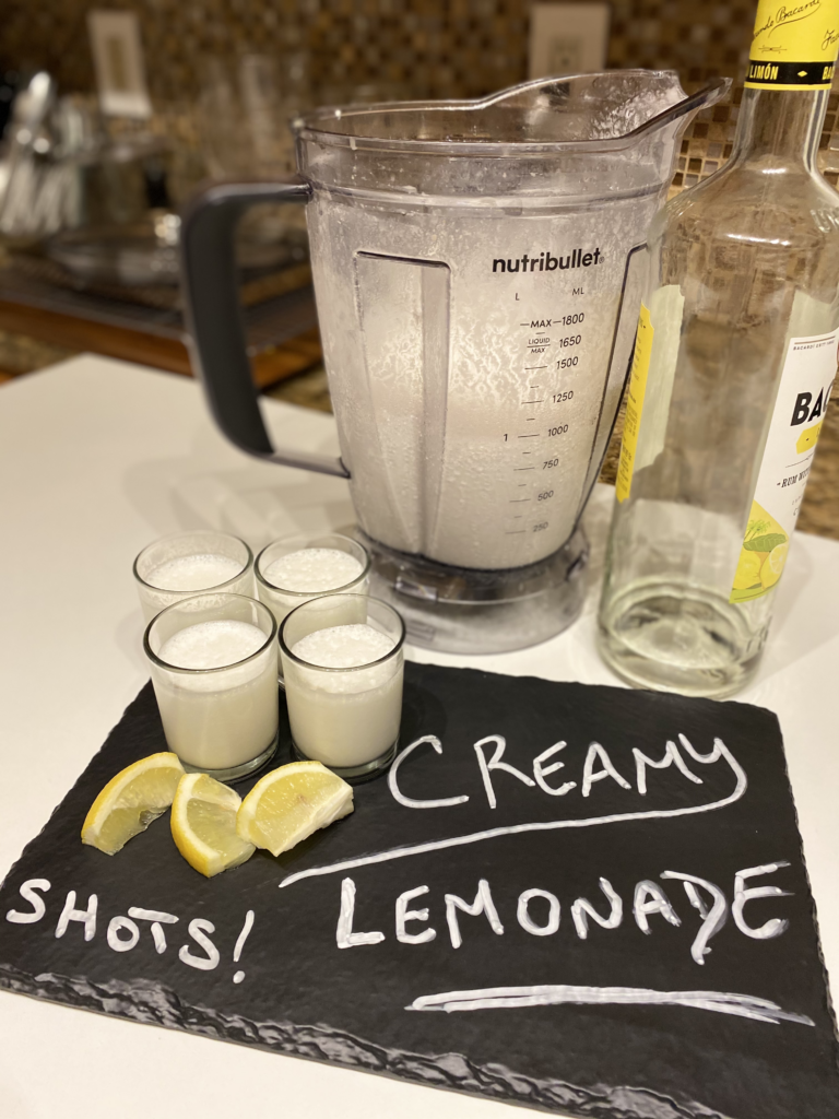 Creamy Lemonade in shot glasses with lemon flavored rum added