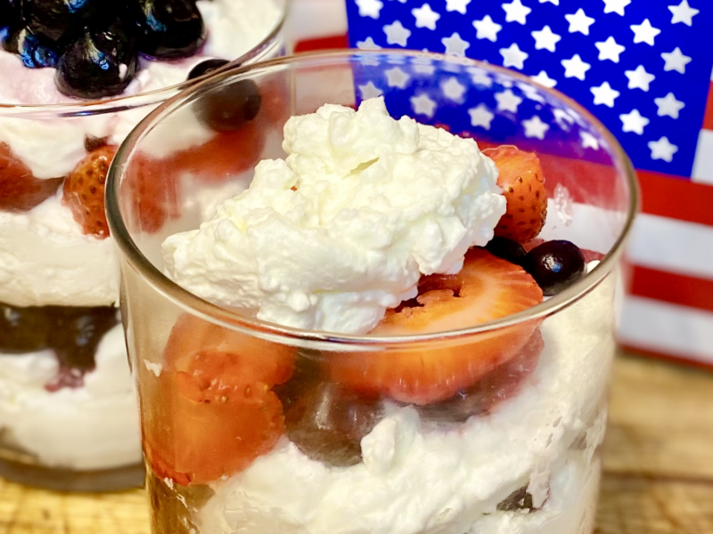 Parfait with whipped cream, strawberries and blueberries