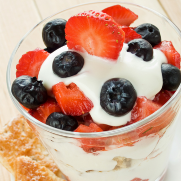 Parfait with strawberies blue berries and cream