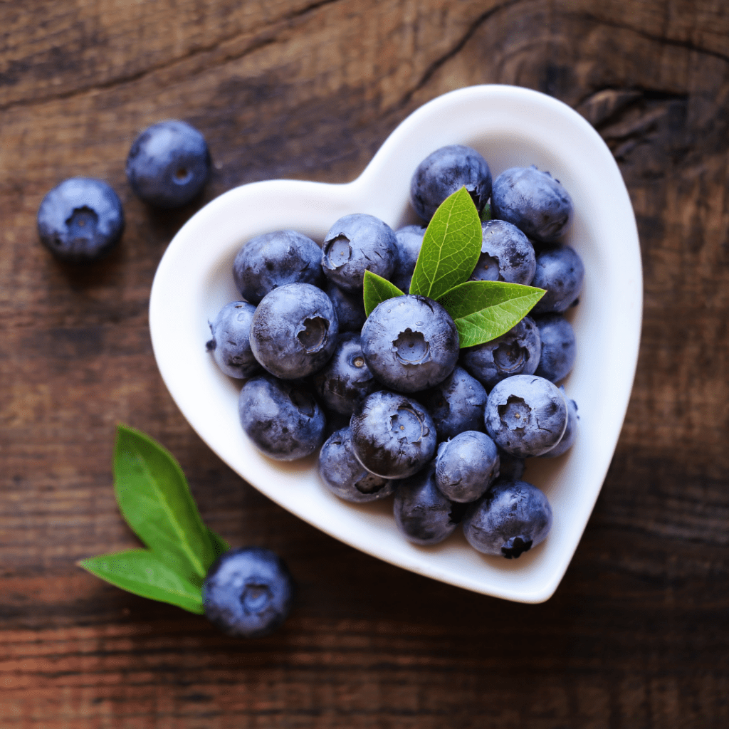 blueberries in a heart shaped bowl