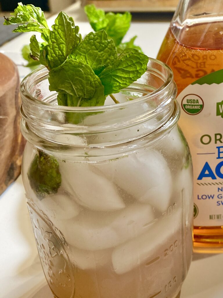 Alcohol free mocktail in a mason jar with mint garnish