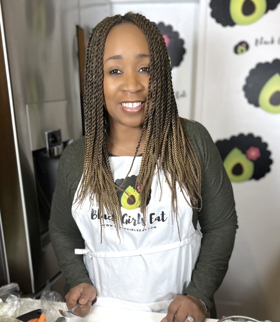 Woman in apron in kitchen