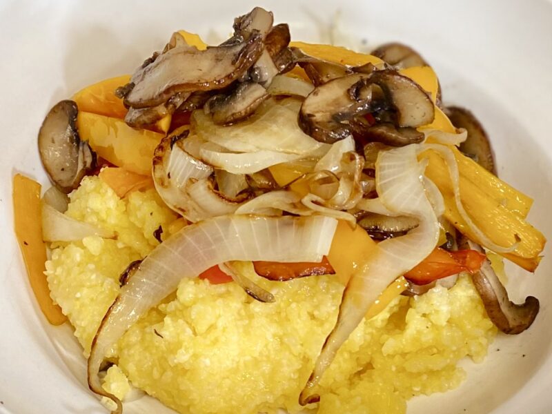 bowl of polenta, mushrooms, peppers and onions