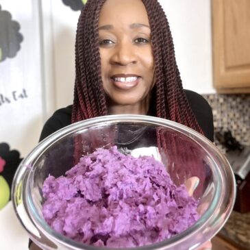 Woman holding bowl of mashed purple potatoes