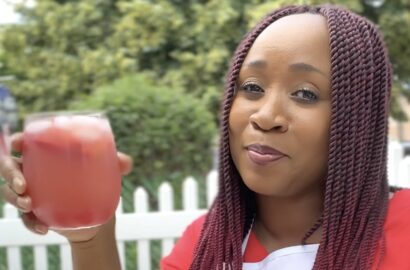 Woman with glass of Red Juneteenth Punch