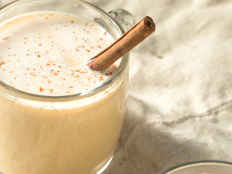 Glass of Coquito with a Cinammon Stick