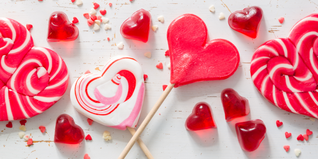 Various heart shaped lolipops in pink white and red