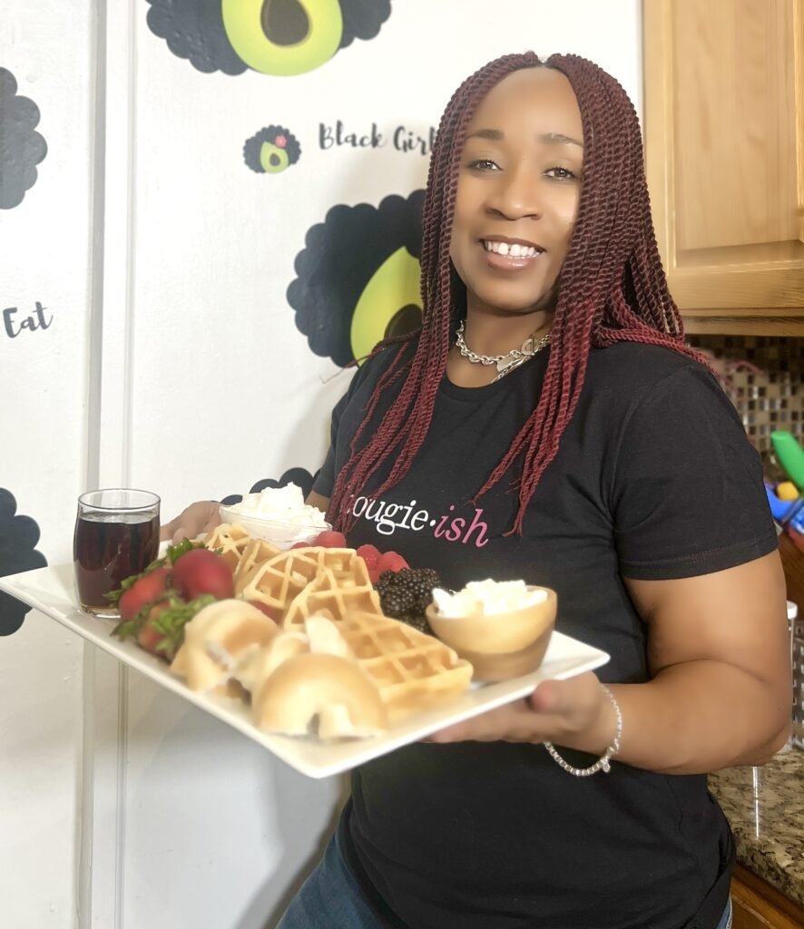 Woman holding a completed breakfast board