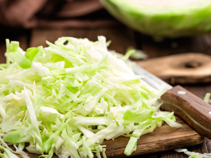 Shredded cabbage on a cutting board