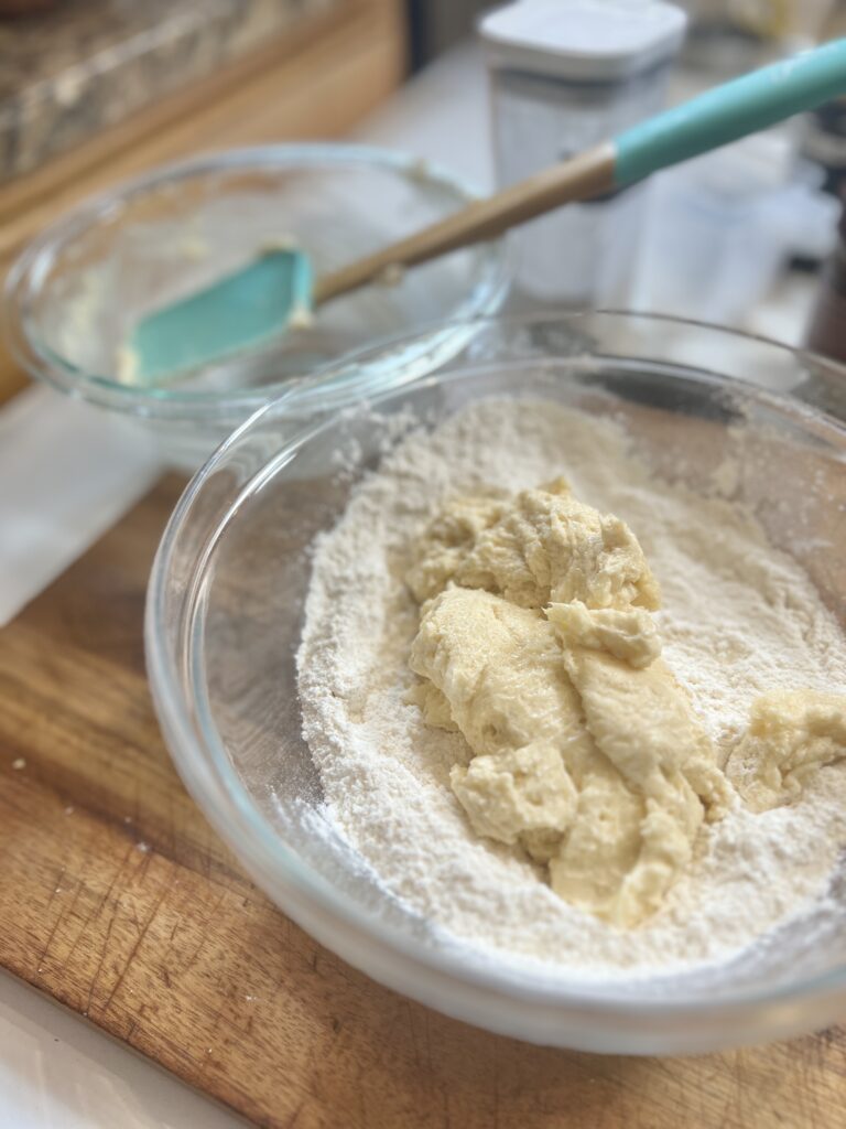 A bowl of dry ingredients and wet ingredients ready to make the dough