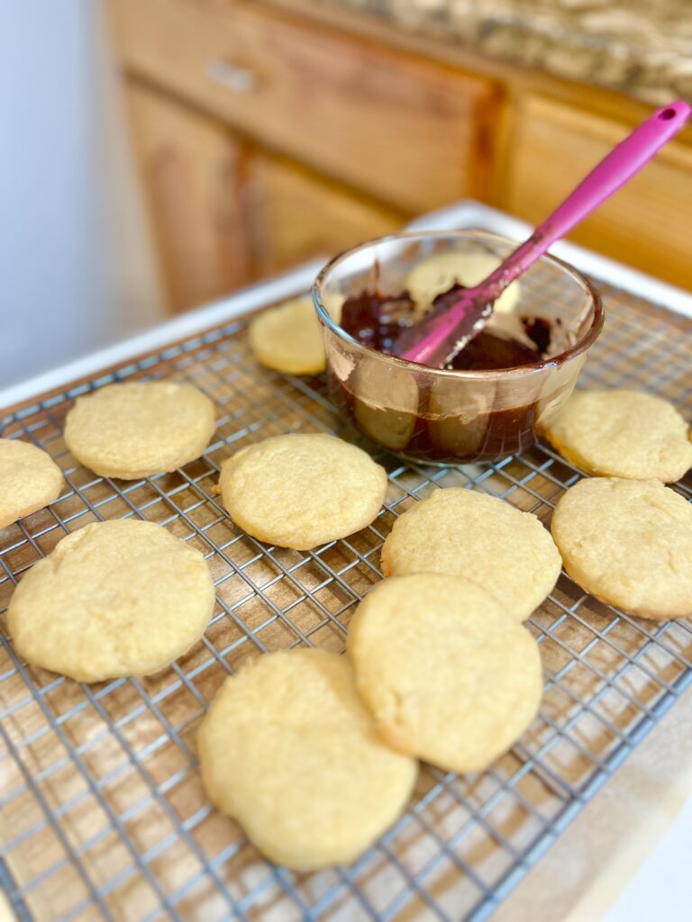 chocolate hummus cookies next to a bowl of chocolate hummus