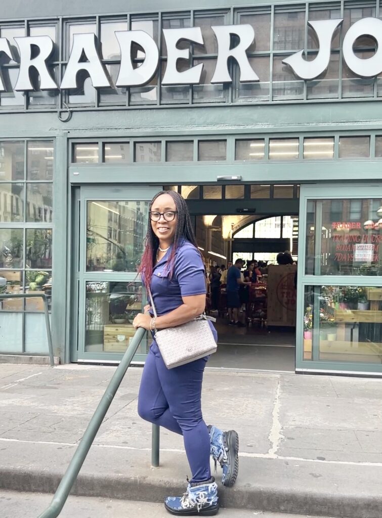 Woman in front of Trader Joe's Entrance