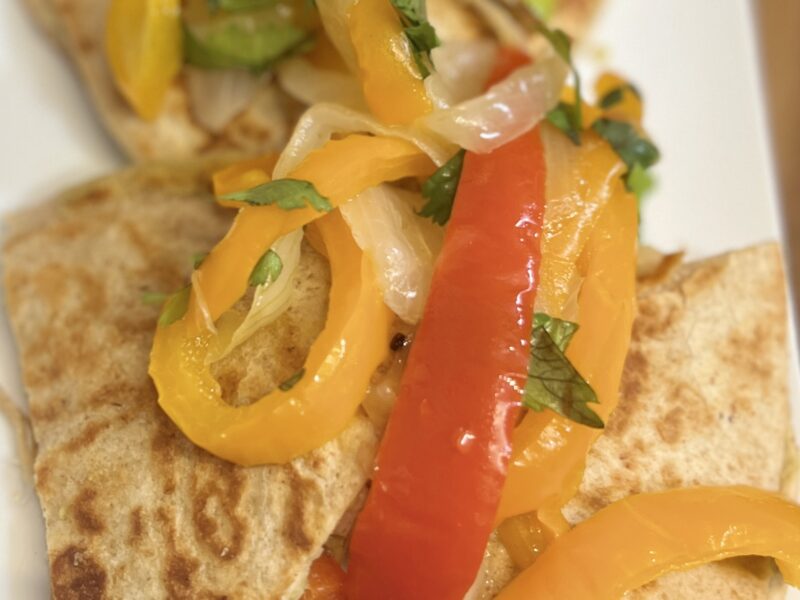 cheese free quesadillas with peppers and onions on a plate