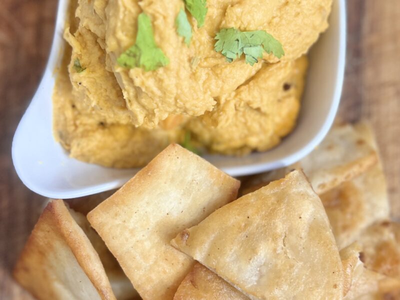 Bowl of Spicy Sweet Potato Hummus and Pita Chips