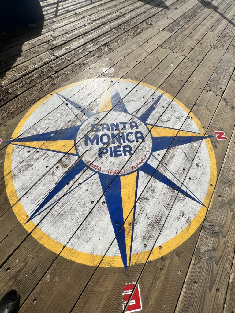 Santa Monica Pier Sign on Wooden Planks