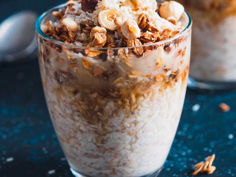 Toasted Oats and nuts on top of a glass of yogurt