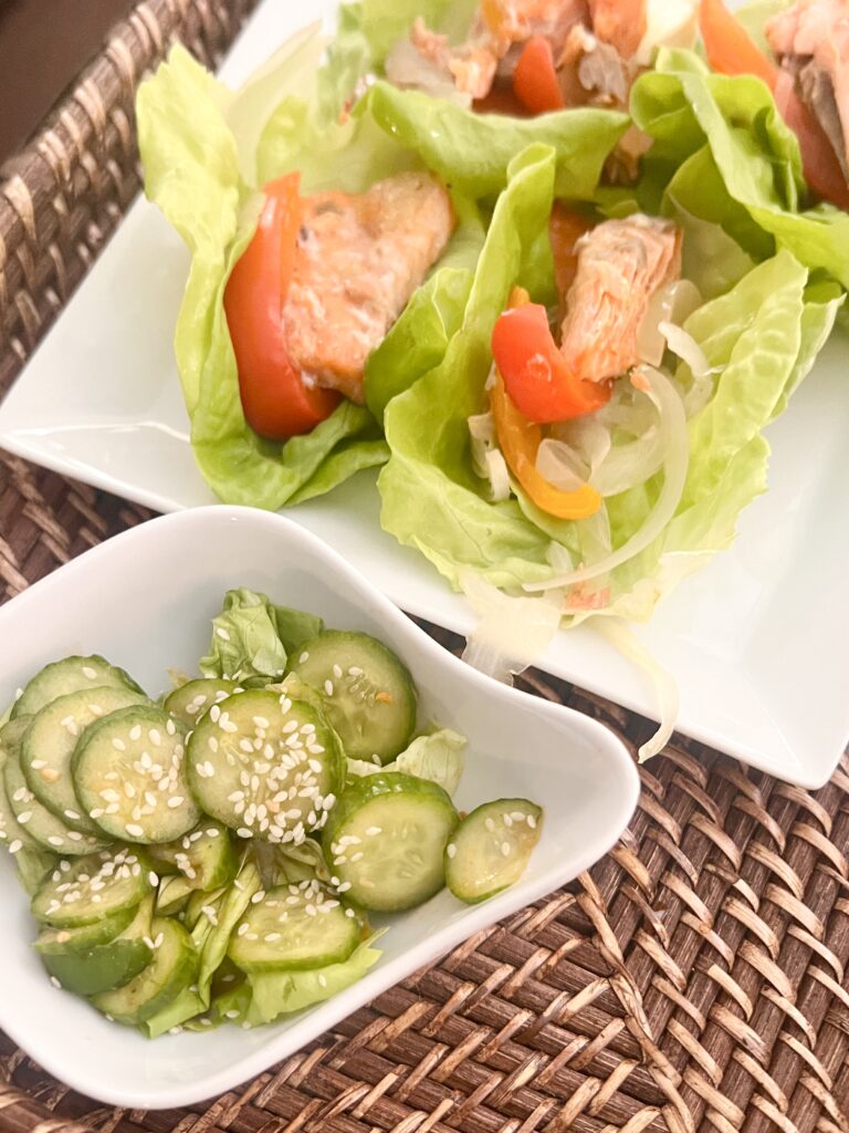 Salmon lettuce wraps with a side of asian cucumber salad