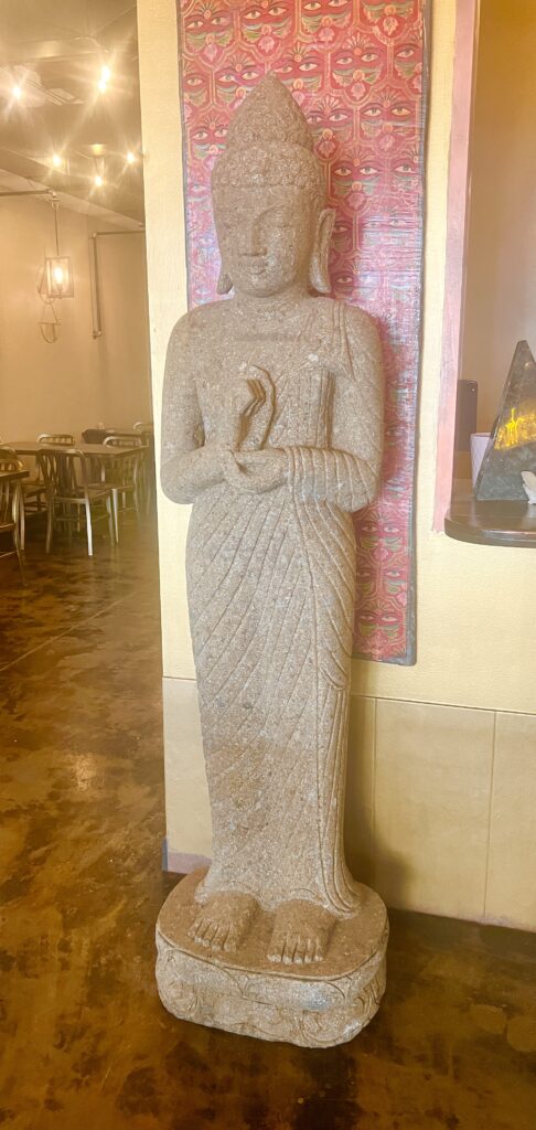 A buddha statue found at Mantra, one of the vegan restaurants featured in this blog post