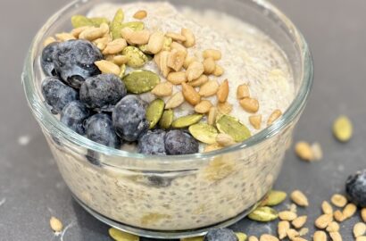 Bowl of Banana Chia Seed Pudding topped with blueberries, pumpkin seeds and sunflower seeds